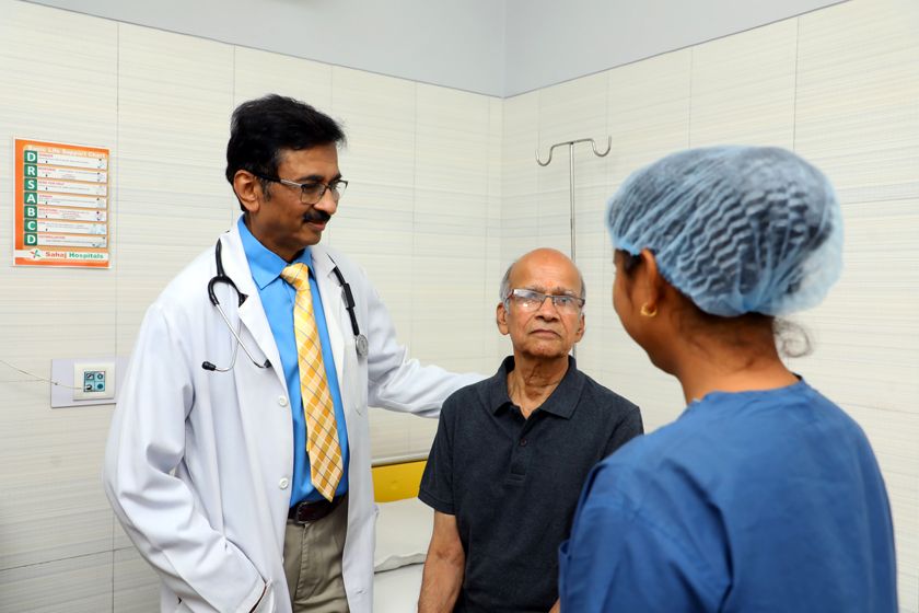 Dr. Singhvi with a patient and a nurse in the day-care unit