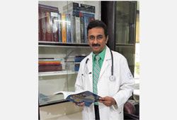 Dr. Singhvi in the clinic library