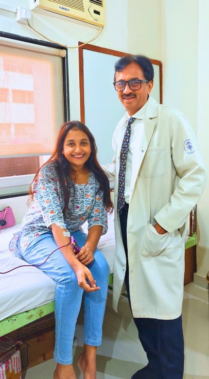 Neha, a sickle cell anemia patient, with Dr. Singhvi at the day-care unit