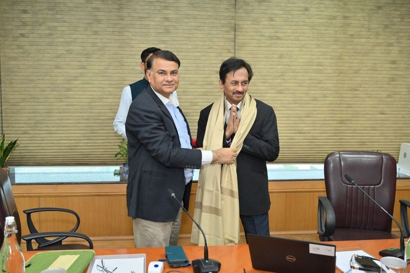 Dr. Singhvi being honoured with a shawl after the session